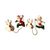 Load image into Gallery viewer, Vintage Commadore Mr. and Mrs. Santa Claus Candle Climber Set
