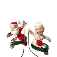 Load image into Gallery viewer, Vintage Commadore Mr. and Mrs. Santa Claus Candle Climber Set
